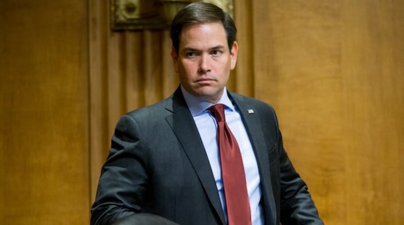 Sen. Marco Rubio, R-Fla., arrives as State Department Under Secretary for Political Affairs Thomas Shannon, Jr., as he appears before a Senate Foreign Relations Committee hearing on Capitol Hill in Washington, Tuesday, April 5, 2016, on recent Iranian actions and implementation of the nuclear deal. (AP Photo/Andrew Harnik)