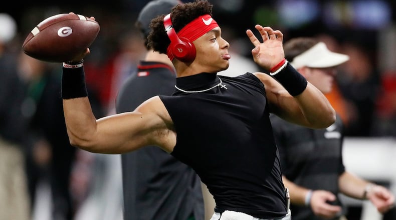 Georgia quarterback Justin Fields throws during an early pregame warm-up before the Bulldogs played Alabama for the SEC championship Saturday, Dec. 1, 2018, at Mercedes-Benz Stadium. BOB ANDRES / BANDRES@AJC.COM