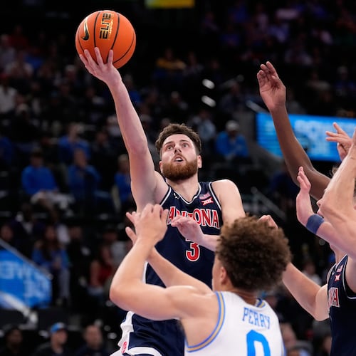 Arizona guard Anthony Dell'Orso (3) shoots as UCLA guard Trent Perry (0) defends during the first half of a Hall of Fame Series college basketball game Friday, Nov. 14, 2025, in Inglewood, Calif. (AP Photo/Mark J. Terrill)
