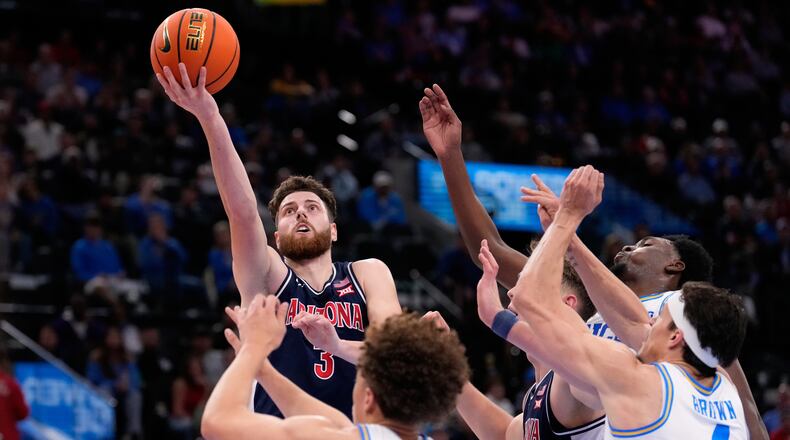 Arizona guard Anthony Dell'Orso (3) shoots as UCLA guard Trent Perry (0) defends during the first half of a Hall of Fame Series college basketball game Friday, Nov. 14, 2025, in Inglewood, Calif. (AP Photo/Mark J. Terrill)