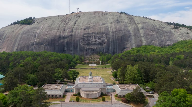 April 20, 2021 Stone Mountain - Aerial photograph shows Memorial Hall (foreground) and Confederate Memorial Carving (background) at Stone Mountain Park on Tuesday, April 20, 2021. (Hyosub Shin / Hyosub.Shin@ajc.com)