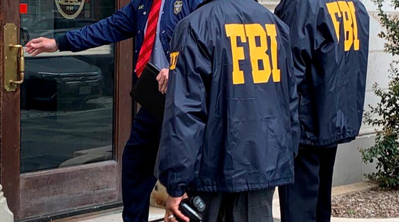 The FBI on Friday raided the home and office of a Washington lobbyist accused of lying about close ties to President Donald Trump in order to score lucrative contracts for his firm.