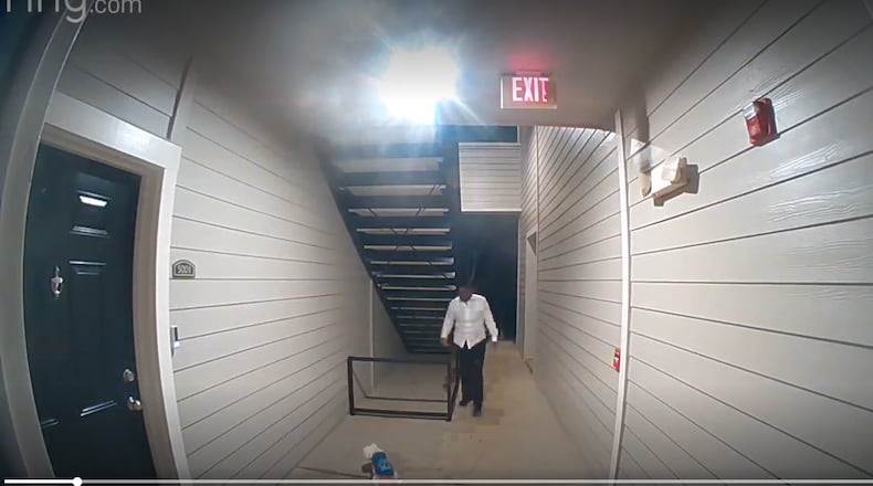 A woman was caught on a neighbor's doorbell camera seriously beating a small white dog in December, Atlanta police said. Dwanisha Rayniece Hitchens was arrested and charged with cruelty to animals.