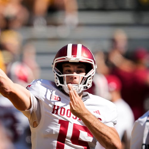FILE - Indiana quarterback Fernando Mendoza warms up before an NCAA college football game against Iowa, Saturday, Sept. 27, 2025, in Iowa City, Iowa. (AP Photo/Charlie Neibergall, File)