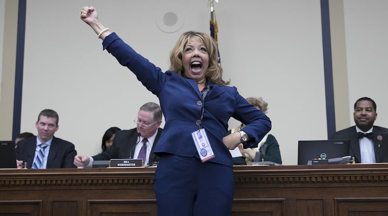 Rep.-elect Lucy McBath, D-Marietta, celebrates after drawing a low number in the lottery for congressional offices on Capitol Hill on Nov. 30, 2018. As part of the new member orientation process, incoming House freshmen take part in drawing random numbers that provide the order for selecting available congressional office space. (Photo by Win McNamee/Getty Images)