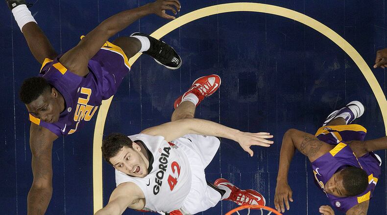 Georgia forward Nemanja Djurisic (42) vies for a rebound against LSU guard Malik Morgan (24) and LSU forward Johnny O'Bryant III (2).