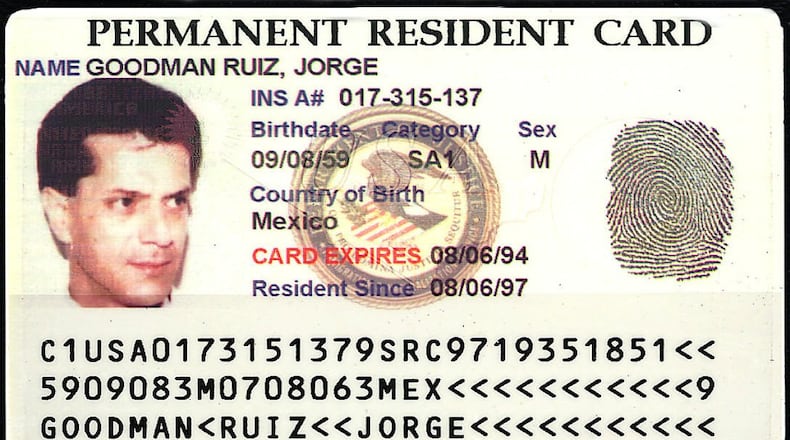 slug: COX-GREEN-CARD WASHINGTON....The Immigration and Naturalization Service unveiled its new high-tech Green Card, which will be issued to permanent residents. The card is embedded with holograms, digital images and other high-tech security devices aimed at keeping undocumented workers from taking U.S. jobs. (Cox Newspapers)