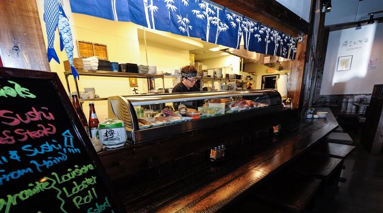 You’ll need a small crowd to actually take a full survey of the menu at Ginya Izakaya. (BECKYSTEIN.COM)