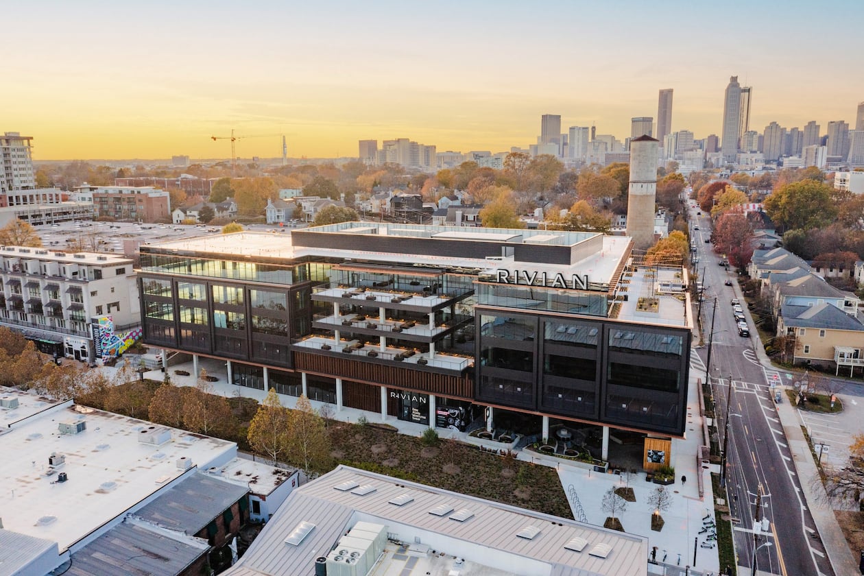 Rivian announced it will establish an East Coast headquarters at Junction Krog District in Atlanta. The photo shows the building with a rendering of Rivian's logo on the facade. (Courtesy of Rivian)