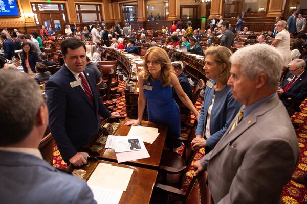 State representatives including (from second left) Scott Hilton, R-Peachtree Corners, Sandy Donatucci, R-Buford, and Deborah Silcox, R-Sandy Springs, speak before a vote on property tax legislation during the special session in the House of Representatives at the Capitol on Saturday. (Arvin Temkar/AJC)