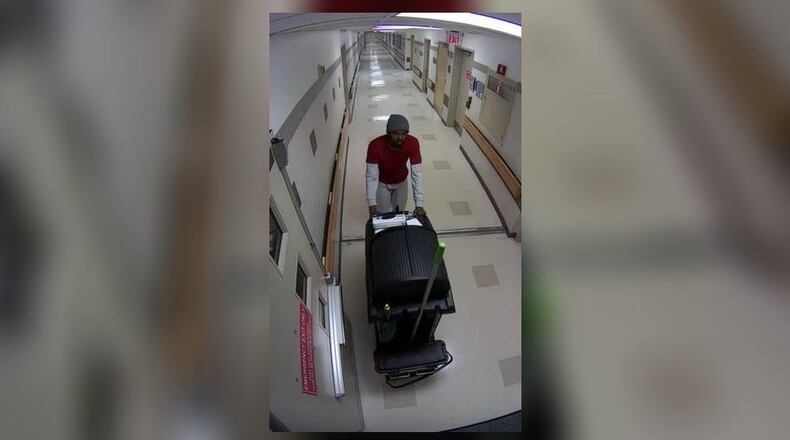 Atlanta police said Thomas Miller posed as a janitor at Grady Memorial Hospital before stealing an employee's iPad and wallet from a locked room.