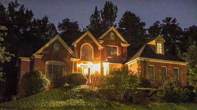 A man and woman were injured after a group of men stormed into their house, took their car and beat them with guns in the same southwest Atlanta subdivision in which Atlanta Mayor Kasim Reed lives.