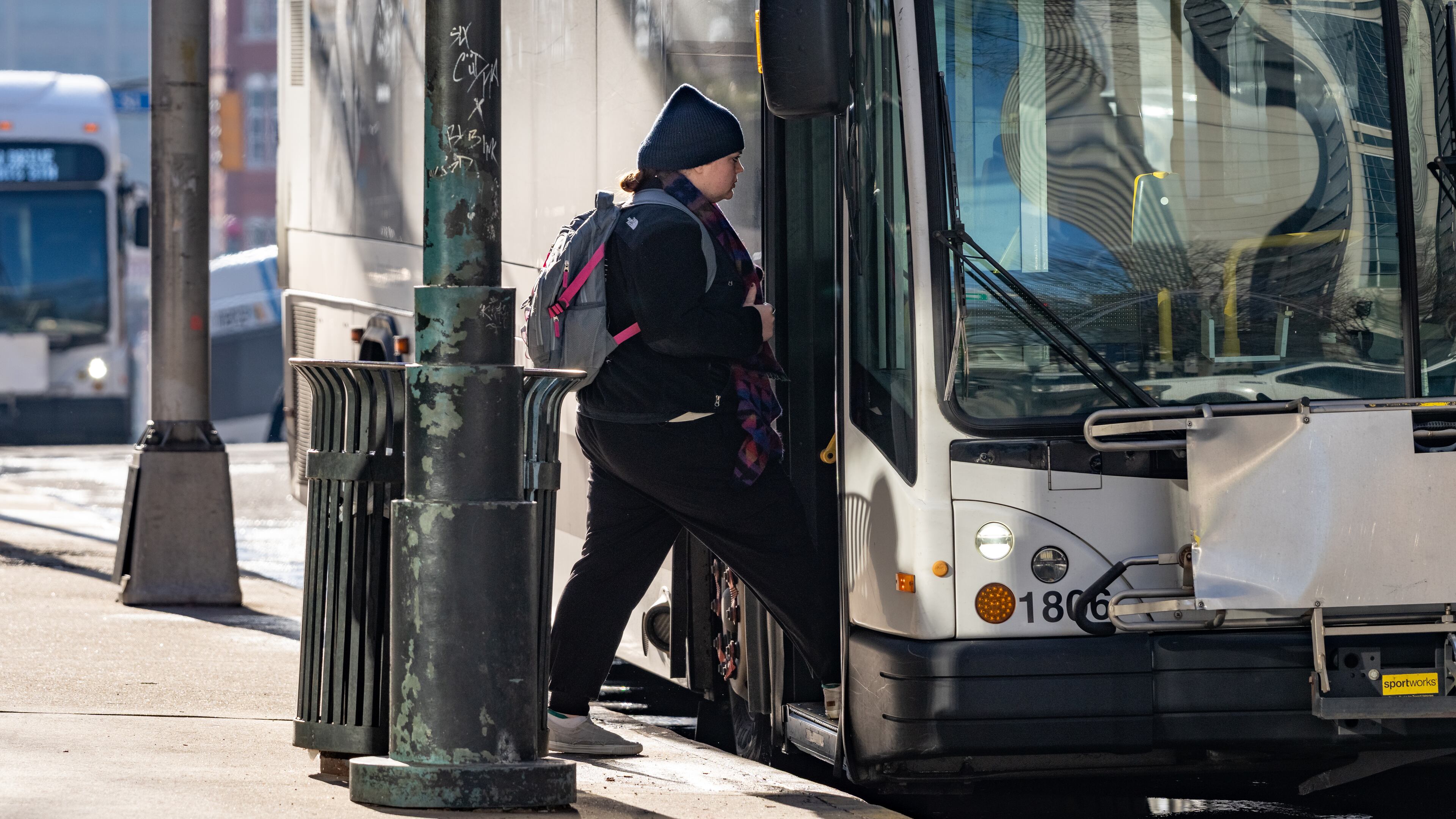 A woman boards a bus outside the Five Points MARTA station in Downtown Atlanta, Monday, Feb. 24, 2025. Although many Atlantans bash MARTA service, Gridlock Guy found it worked well for his commute. (Ben Hendren for the AJC)