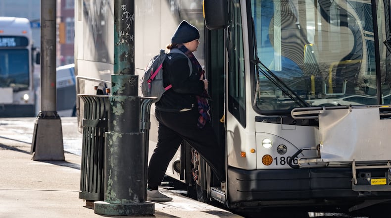 A woman boards a bus outside the Five Points MARTA station in Downtown Atlanta, Georgia. Monday, February 24, 2025 (Ben Hendren for the Atlanta Journal-Constitution)