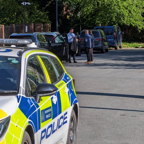 Police officers patrol at a cordon near Kenton United Synagogue in Harrow, a suburb of London, Sunday, April 19, 2026. (Jamie Lashmar/PA via AP)