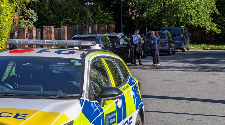 Police officers patrol at a cordon near Kenton United Synagogue in Harrow, a suburb of London, Sunday, April 19, 2026. (Jamie Lashmar/PA via AP)