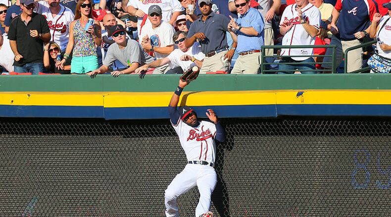 100512 ATLANTA: Atlanta Braves right fielder Jason Heyward (22) makes a leaping catch of St. Louis batter Yadier Molina's pop fly in the second inning of the National League wild card game at Turner Field in Atlanta on Friday, Oct. 5, 2012. CURTIS COMPTON / CCOMPTON@AJC.COM Jason Heyward recently was selected as defensive player of year. (Curtis Compton, AJC)