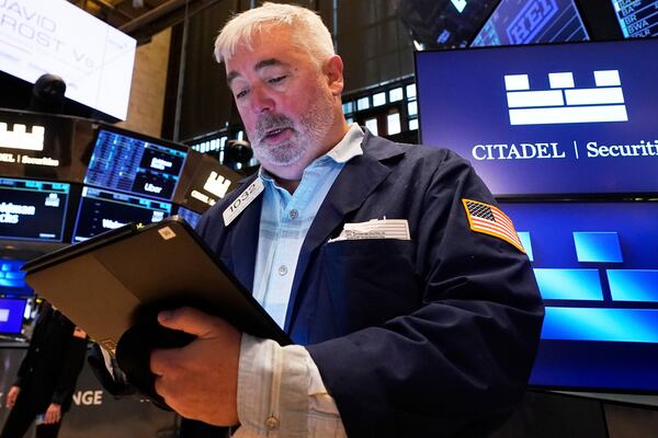 Trader Edward McCarthy works on the floor of the New York Stock Exchange, Monday, April 14, 2025. (AP Photo/Richard Drew)