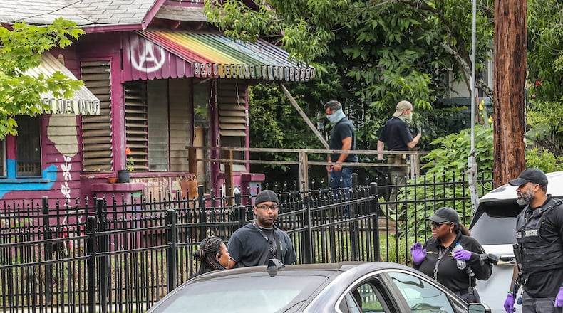 May 31, 2023 Atlanta: Atlanta police and the GBI work the scene on Three people were arrested Wednesday morning, May 31, 2023 on Mayson Avenue near Hardee Street in Atlanta in connection with alleged crimes committed at the future site of the public safety training center, as well as other metro locations.. Marlon Scott Kautz, 39, of Atlanta, Savannah D. Patterson, 30, of Savannah, and Adele Maclean, 42, of Atlanta, were each charged with money laundering and charity fraud. According to the GBI, the arrests stem from an ongoing investigation and include numerous alleged criminal acts at the site. A search warrant was executed by the GBI and the Atlanta Police Department. Investigators said they found evidence linking the three to the financial crimes, the GBI said. SWAT, uniform officers and crime scene investigators were at a house, known as the Teardown House, Wednesday morning to arrest them. The house is covered in art and is located just a couple of houses down from the Edgewood APD precinct. Officers were seen coming in and out of the house on Wednesday morning. Protestors against the training center said the three arrested are part of the Atlanta Solidarity Fund, an organization that provides monetary and legal support for those arrested. In a statement, Attorney General Chris Carr said the arrests were “about the violence that occurred at the site of the future Atlanta Public Safety Training Center and elsewhere.” “As we have said before, we will not rest until we have held accountable every person who has funded, organized or participated in this violence and intimidation,” Carr, whose agency is jointly prosecuting the case with the DeKalb County District Attorney’s Office, said in a statement. The arrests come three months after 23 people were charged March 5 with domestic terrorism by the GBI after allegedly throwing large rocks, bricks, Molotov cocktails and fireworks at officers at the training center site. Most of those arrested have been granted bond. Two were denied bond last week. At least seven people were arrested and charged with domestic terrorism in January. During a protest after Georgia State Patrol troopers shot and killed Manuel Teran, also known as “Tortuguita,” Kautz warned the media and others not to accept the police version of Teran’s death and vowed his organization would “pursue a vigorous legal strategy and investigation of (Teran’s) killing,” The Atlanta Journal-Constitution reported. “I just want to urge people to not allow this repression to give you fear, and to keep doing what you’re doing,” Kautz said at the January protest. During Mayor Andre Dickens’ State of the City address in March, Kautz was one of the activists who spoke in a conference room voicing concerns. Kautz said they’ve witnessed law enforcement hindering the right to protest, be it in the forest or elsewhere. Next week, the Atlanta City Council will vote on legislation to increase the city’s contribution to the training center from $31 million to $67 million. It is expected to pass. (John Spink / John.Spink@ajc.com)