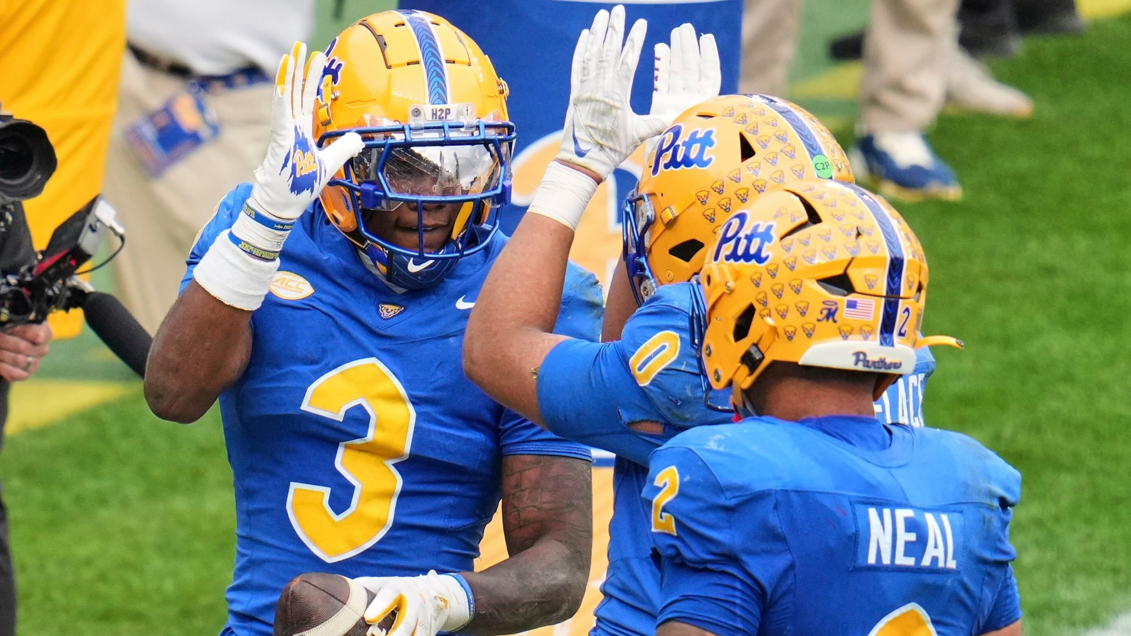 Pittsburgh linebacker Rasheem Biles (3) celebrates with linebacker Braylan Lovelace (0) after returning an interception for a touchdown during the second half of an NCAA college football game against Notre Dame in Pittsburgh, Saturday, Nov. 15, 2025. (AP Photo/Gene J. Puskar)