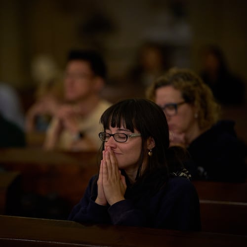 Parishioners pray during a mass in the crypt of the Sagrada Familia in Barcelona, Spain, Friday, May 15, 2026. (AP Photo/Emilio Morenatti)