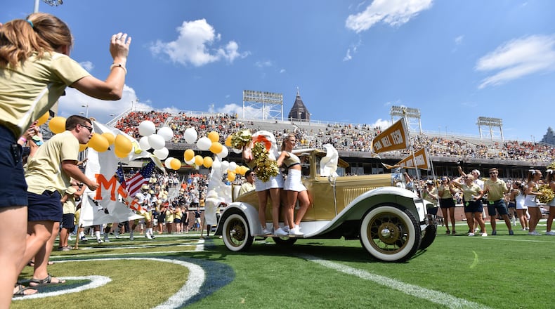 September 10, 2016 Atlanta - Georgia Tech's Ramblin' Wreck leads the band, cheerleaders, Buzz, players, and coaches before the start of the Georgia Tech home opener against against the Mercer on Saturday, September 10, 2016. HYOSUB SHIN / HSHIN@AJC.COM
