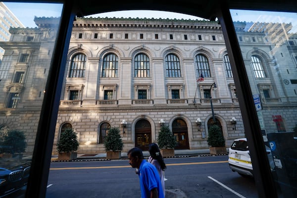 People walk in front of The Elbert P. Tuttle U.S. Court of Appeals Building indowntown Atlanta is seen on Tuesday, March 26, 2025. 
(Miguel Martinez/ AJC)