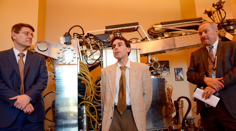 From left, Gary Fedder, the CEO of the Advanced Robotics in Manufacturing Institute, a nonprofit affiliated with Carnegie Mellon University, stands with chief technical officer Howie Choset and chief operating officer Jay Douglas at a National Robotics Engineering Center event in Lawrenceville on April 12, 2017. (Lake Fong/Pittsburgh Post-Gazette/TNS)