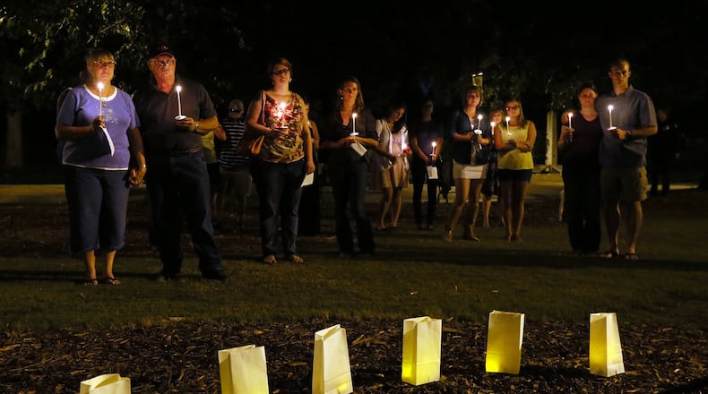 Metro area residents participate in a Sept. 12 candlelight vigil sponsored by the Metro Atlanta Chapter of the American Foundation for Suicide Prevention in Piedmont Park in Atlanta. The event helps promote awareness that depression and other mental illnesses are just that - illnesses. Not weaknesses or character flaws. Depression is one of the leading causes of suicide.