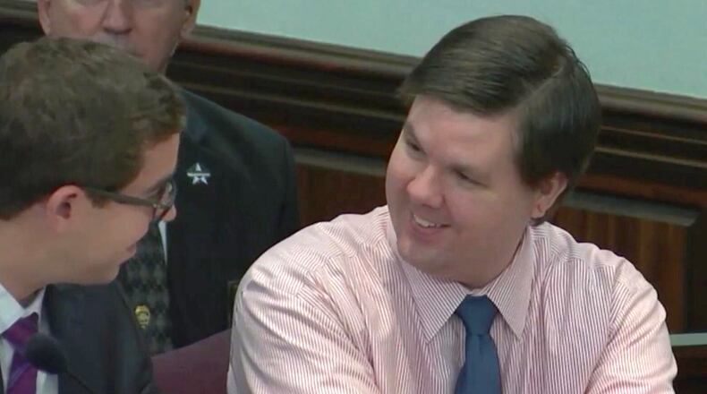 Justin Ross Harris smiles while talking with defense attorney Carlos Rodriguez Tuesday morning. The prosecution and defense were in the process of gathering together evidence to send to the jury room. (Screen capture via WSB-TV)
