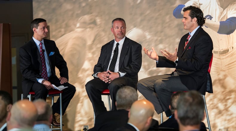 Jim Powell (left) chats with Mark Lemke (middle) and Chip Caray during a tribute to fellow broadcaster Don Sutton in 2015 at Turner Field in Atlanta. (Photo/John Amis)