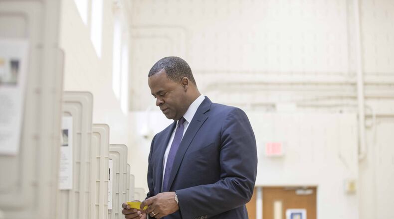 12/05/2017, Atlanta, GA, - Atlanta mayor Kasim Reed casts his vote for the Atlanta mayoral run-off election at Fickett Elementary School, Tuesday, December 5, 2017. A few days later, the mayor threatened unsuccessful mayoral candidate Mary Norwood with legal action because of accusations that his campaign manipulated voters in 2009. ALYSSA POINTER/ALYSSA.POINTER@AJC.COM
