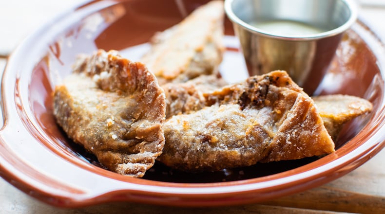 The plantain empanadas at Porch Light Latin Kitchen have a decidedly rustic appearance. CONTRIBUTED BY HENRI HOLLIS