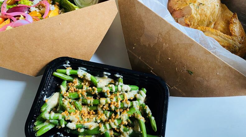 This takeout order of garlic green beans, Little Gem salad and roasted chicken is from Wonderkid. CONTRIBUTED BY BOB TOWNSEND