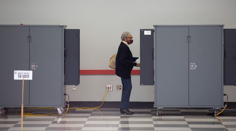People wait cast their votes at the Cobb County Elections Department in Marietta, Ga., in Atlanta, Monday, Dec. 14, 2020, during the first day of in-person advance voting in the Georgia runoff election for two U.S. Senate seats. The Jan. 5 contests will determine whether two incumbents, Sens. David Perdue (R-Ga.) and Kelly Loeffler (R-Ga.) keep their seats. (Lynsey Weatherspoons/The New York Times)