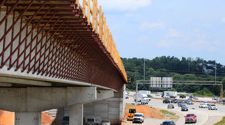The express lane bridge over the Canton Road Connector. I-75 is to the right. Construction on the Northwest Corridor reversible-lane project is expected to conclude in 2018. BOB ANDRES / BANDRES@AJC.COM