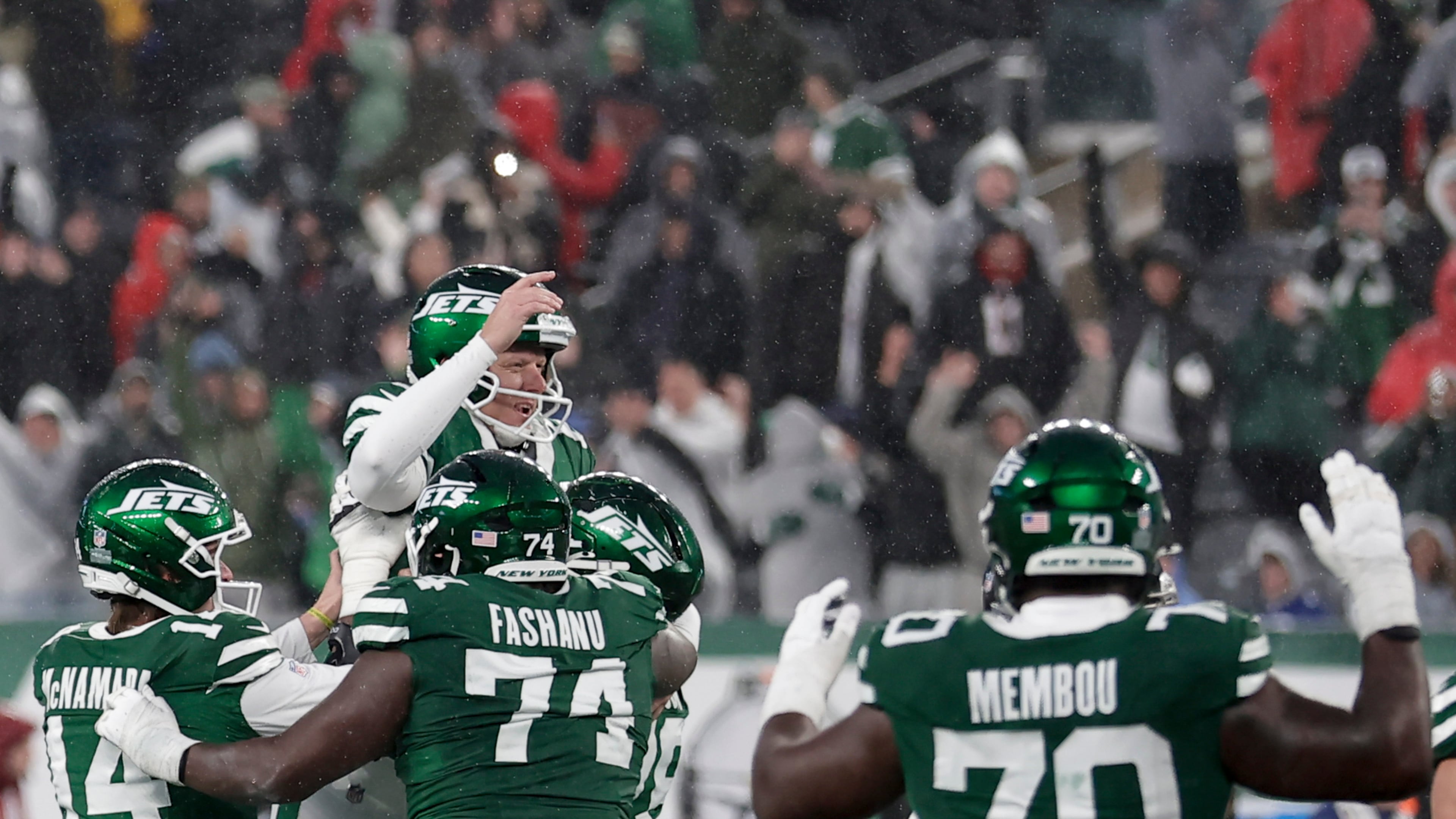 New York Jets place kicker Nick Folk (6) celebrates with teammates after he kicked the game-winning field goal against the Atlanta Falcons during the second half of an NFL football game, Sunday, Nov. 30, 2025, in East Rutherford, N.J. (AP Photo/Adam Hunger)