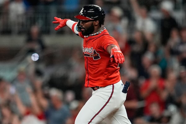 Atlanta Braves' Michael Harris II (23) celebrates his three-run home run against the Colorado Rockies in the sixth inning of a baseball game, Friday, June 13, 2025, in Atlanta. (AP Photo/Mike Stewart)