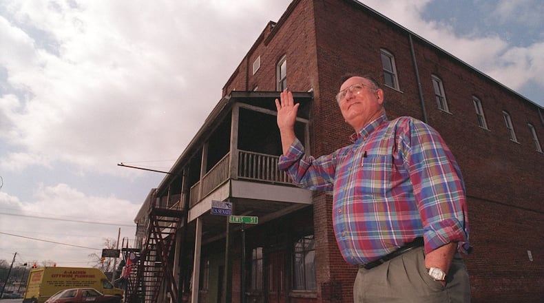 Former Kennesaw Mayor J.O. Stephenson waves to a friend while on Main Street in downtown Kennesaw. (AJC Photo/Andy Sharp)