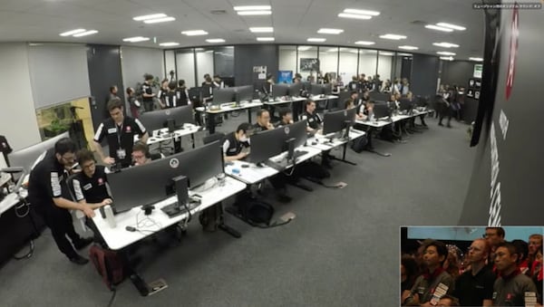 This image taken from video shows flight controllers at ispace Mission Control in Tokyo awaiting confirmation of their private lunar lander touching down on the moon Friday, June 6, 2025. (ispace via AP)
