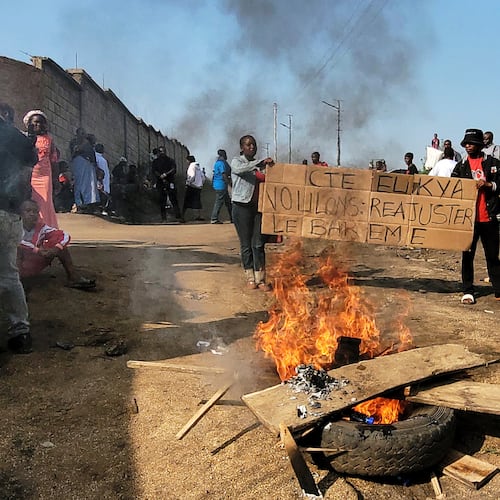 Rubble set on fire as health and frontline workers protest at the Elikya Ebola Treatment Center in Bunia, Congo, on Saturday, July 25, 2026. (AP Photo/Constant Same Bagalwa)