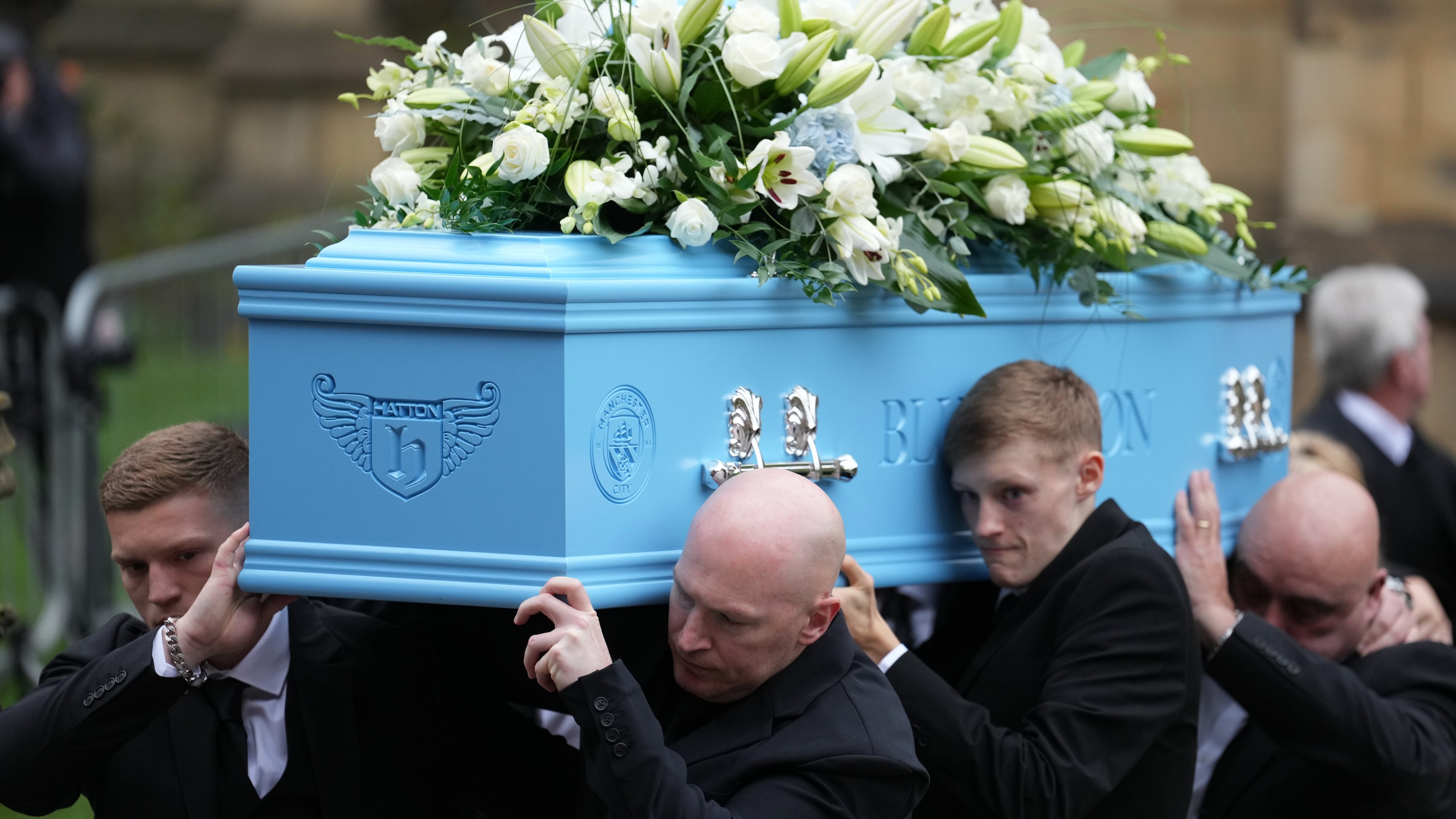 Family members carry the coffin of boxer Ricky Hatton out of Manchester Cathedral following his funeral in Manchester, England, Friday, Oct. 10, 2025. (AP Photo/Jon Super)