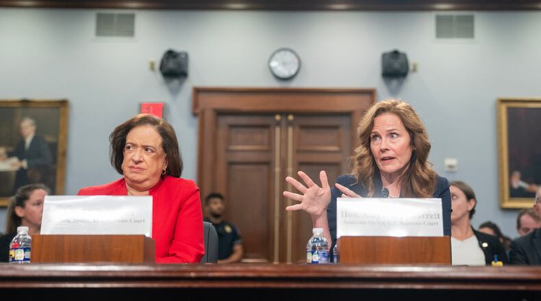 Supreme Court Justices Amy Coney Barrett, right, and Elena Kagan testify during a House Appropriations subcommittee hearing, Tuesday, July 14, 2026, on Capitol Hill in Washington. (AP Photo/Nathan Howard)