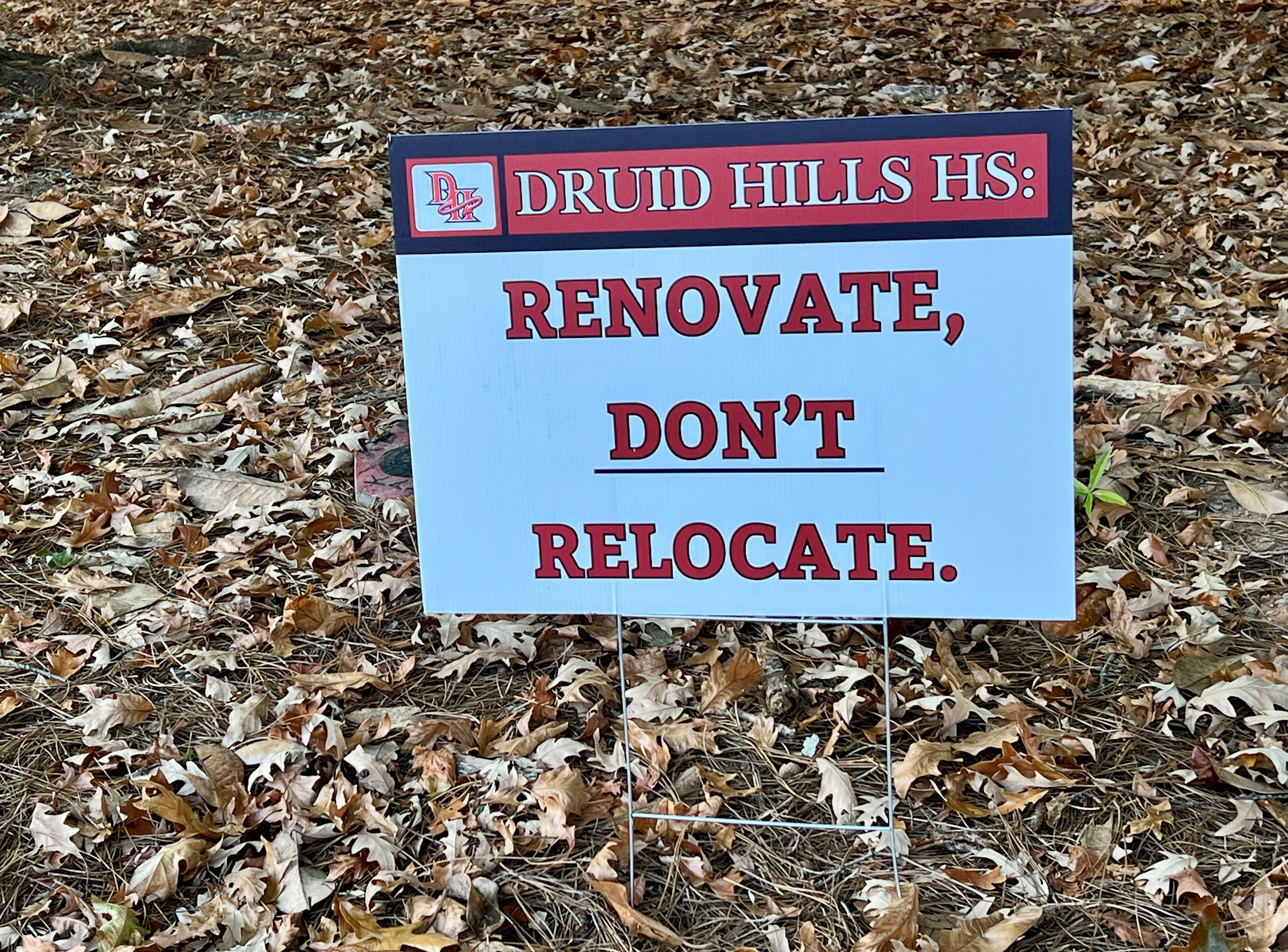 A sign outside of Druid Hills High School in DeKalb County urges leaders to "renovate, don't relocate." (Cassidy Alexander/AJC)