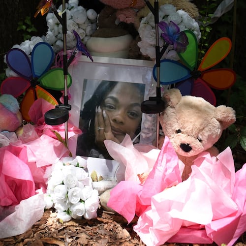 A makeshift memorial honoring Tasia Fortune stands in the backyard of the property where her body was found. Photo taken on Monday, Aug. 10, 2026, in Jackson, Miss. (AP Photo/Sophie Bates)