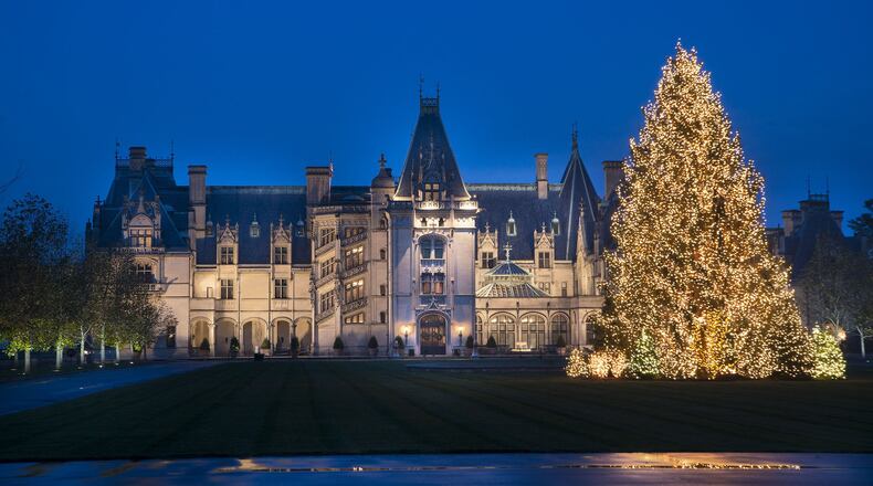 A 55-foot Norway spruce tree wrapped in 45,000 white lights stands in front of the Biltmore House at Biltmore Estate in Asheville, N.C. CONTRIBUTED BY BILTMORE ESTATE