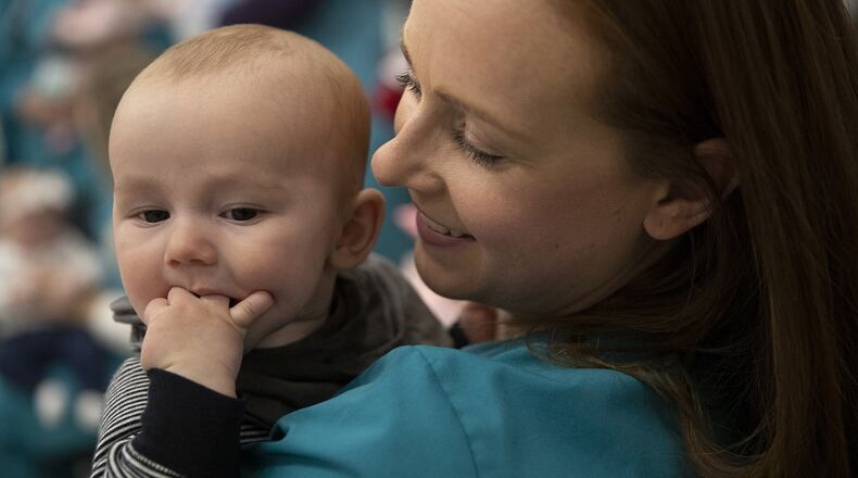Alissa Evangelist holds her son, Jacob, who is 4 months, during a play date at Einstein Medical Center Montgomery on Wednesday, Dec. 4, 2019. Fifteen nurses from the Mom/Baby units at the hospital had babies this year. Heather Khalifa/The Philadelphia Inquirer/TNS
