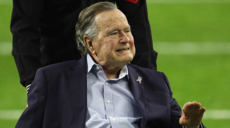 HOUSTON, TX - FEBRUARY 05:  President George H.W. Bush arrives for the coin toss prior to Super Bowl 51 between the Atlanta Falcons and the New England Patriots at NRG Stadium on February 5, 2017 in Houston, Texas.  (Photo by Patrick Smith/Getty Images)