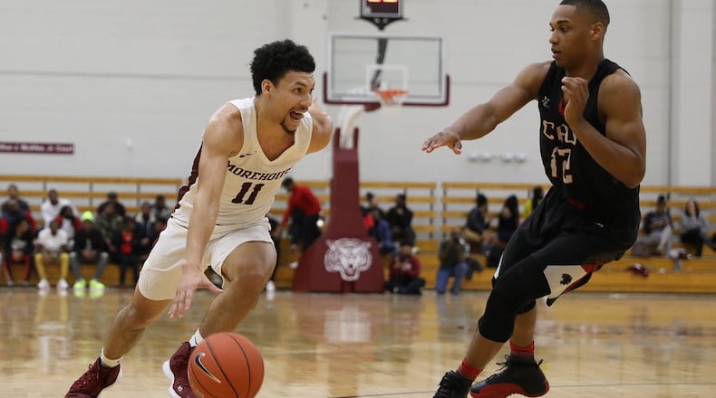 Morehouse guard Michael Olmert (11) drives to the basket while being defended by a Clark Atlanta player during a college basketball game, Saturday, Feb. 9, 2019, in Atlanta. BRANDEN CAMP/SPECIAL