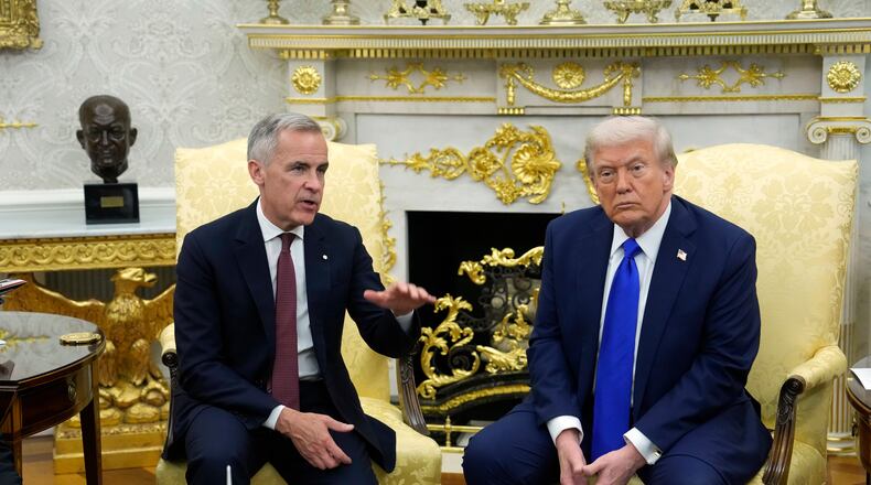 FILE - Canada Prime Minister Mark Carney and President Donald Trump hold a press conference at the White House in Washington, D.C., Oct. 7, 2025. (Adrian Wyld/The Canadian Press via AP, File)